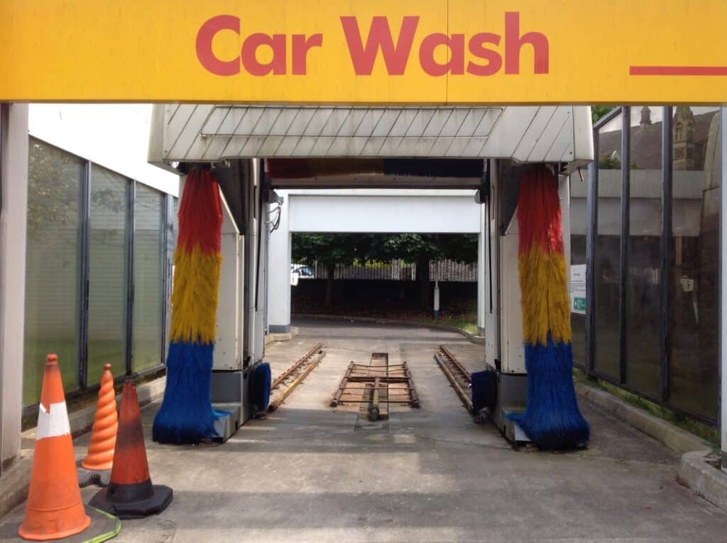 A car wash facility featuring a prominent sign that reads "Car Wash," indicating services available for vehicles.